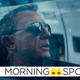 Daniel Craig's James Bond, wearing sunglasses, sits in the passenger seat of a small stealth plane.
